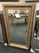 A 4' x 2' golden framed mirror