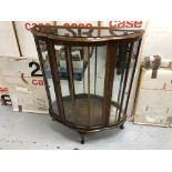 A mid 20th century walnut display cabinet