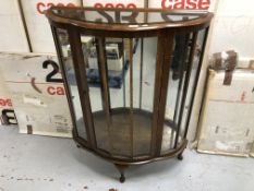 A mid 20th century walnut display cabinet