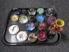 A tray of seventeen assorted glass paperweights and an art glass vase