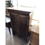 A late 19th century mahogany and walnut double door cabinet fitted a drawer above with pillar