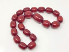 A cherry amber coloured bead necklace, untested CONDITION REPORT: Gross weight 211.