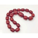 A cherry amber coloured bead necklace, untested CONDITION REPORT: Gross weight 211.