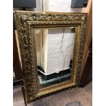 A highly ornate reproduction gilt and gesso cushion frame CONDITION REPORT: Some