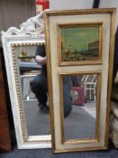 A white and gilt framed mirror,