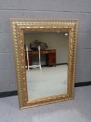 A contemporary gilt framed mirror