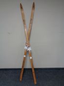 A pair of wooden Asnes Veteran skis with binding