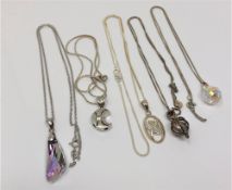 Five silver pendants on chains (5)
