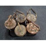 A tray of five antique copper kettles