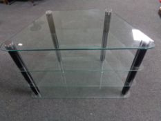 A shaped contemporary glass four-tier television stand