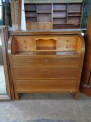 A mid 20th century barrel fronted bureau fitted three drawers beneath