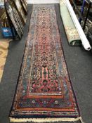 A North-West Persian runner, 450cm by 100cm CONDITION REPORT: Pile generally good.