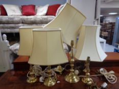 Seven assorted brass table lamps,