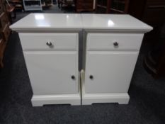 A pair of contemporary white bedside cabinets fitted a drawer