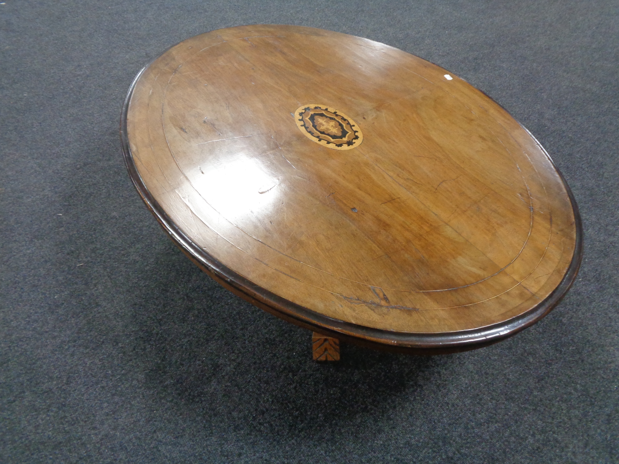 A Victorian inlaid mahogany oval pedestal occasional table (adapted as a coffee table)