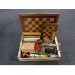 A box of chess boards and pieces, picture frames, dressing table brush sets,