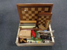 A box of chess boards and pieces, picture frames, dressing table brush sets,