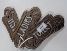 Three cast iron Art Nouveau signs