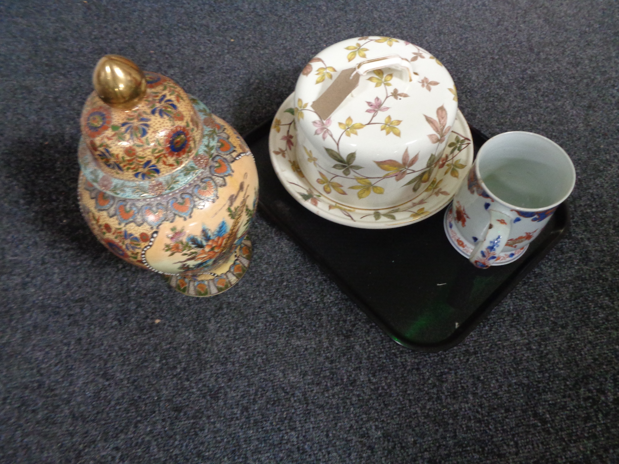A tray of oriental style tankard, lidded vase,