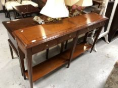 A Multiyork yew wood console table fitted four drawers,