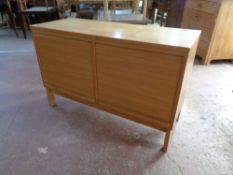 A mid 20th century double shutter front low sideboard