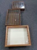 Three wall mounted display cabinets