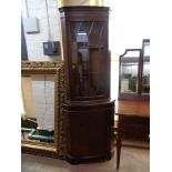 A mahogany Regency style corner display cabinet