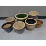 Eight garden plant pots