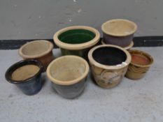 Eight garden plant pots