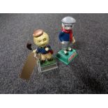 Two small cast iron golfing figures