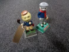 Two small cast iron golfing figures