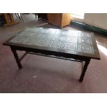 A 20th century oak tile top refectory coffee table