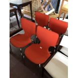 A set of four 20th century Mobelindustri Duba chairs upholstered in a red fabric on tubular metal