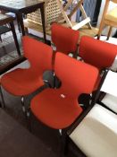 A set of four 20th century Mobelindustri Duba chairs upholstered in a red fabric on tubular metal