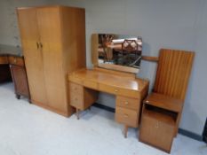 A 20th century CWS Limited double door teak wardrobe and dressing table,
