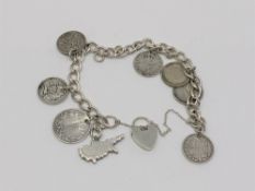 A silver padlock bracelet set with antique coins, Victorian sixpence etc.