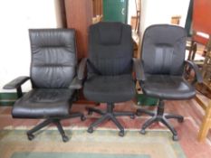 Three swivel office armchairs