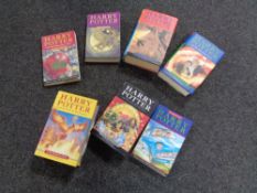 A crate of seven Harry Potter volumes