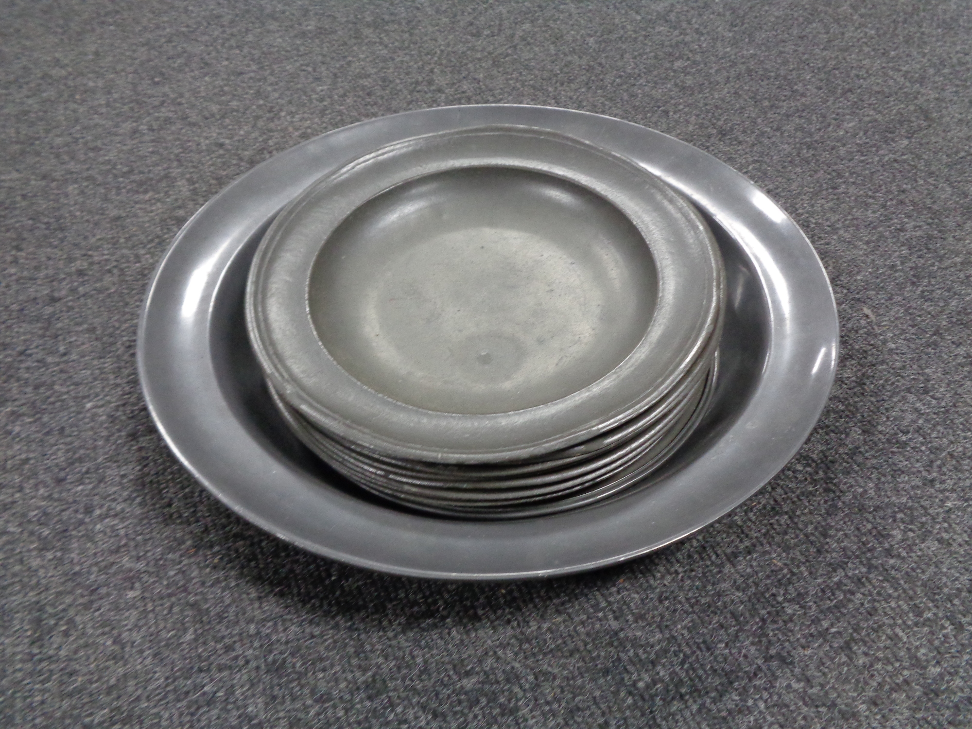 Ten antique pewter dishes and bowls