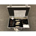 A 23-piece shotgun and rifle cleaning kit, in metal case, new and never used.