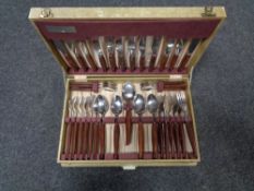 A canteen of Glosswood teak handled stainless steel cutlery