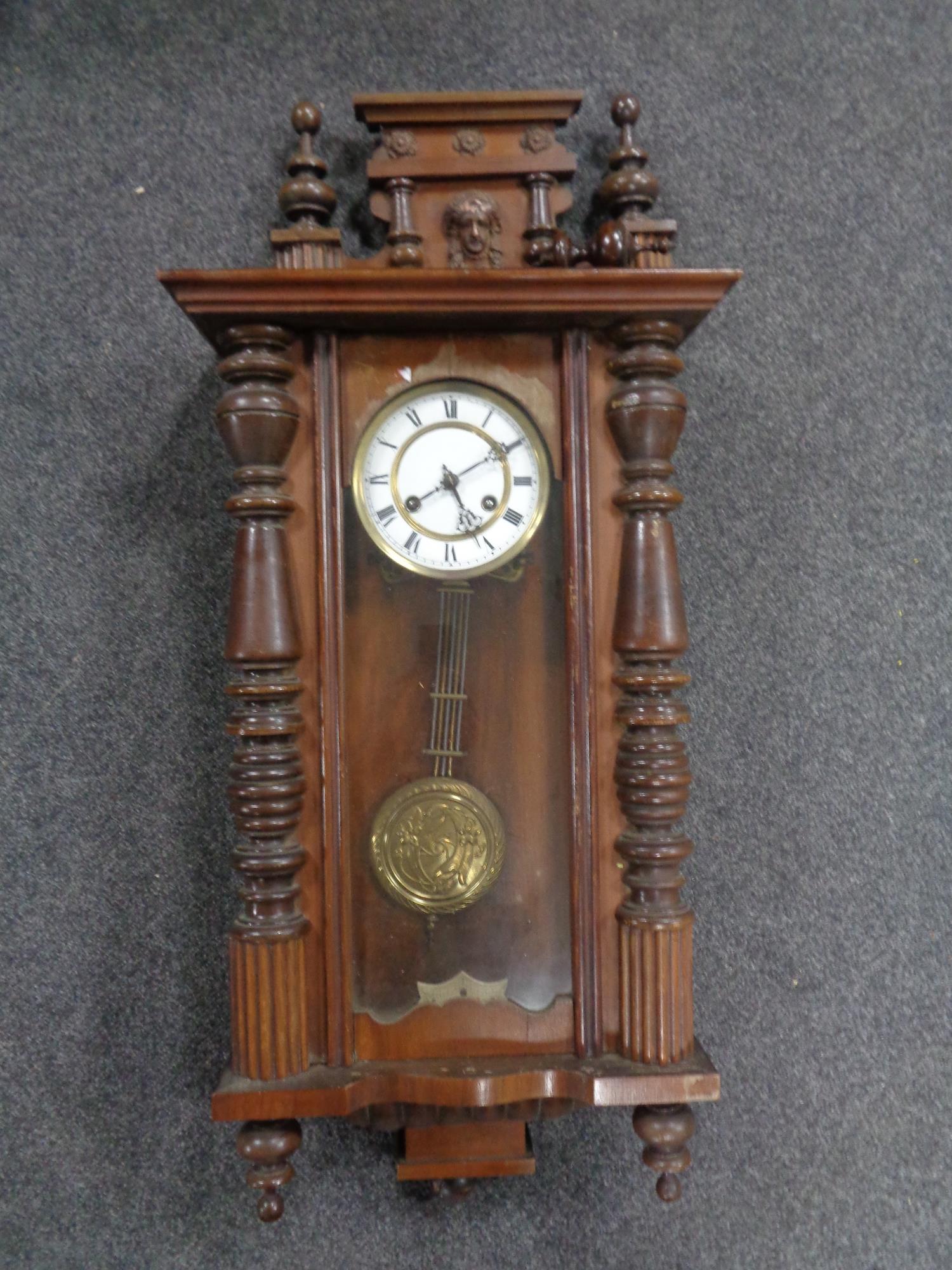 An Edwardian mahogany cased eight day wall clock with brass and enamelled dial CONDITION