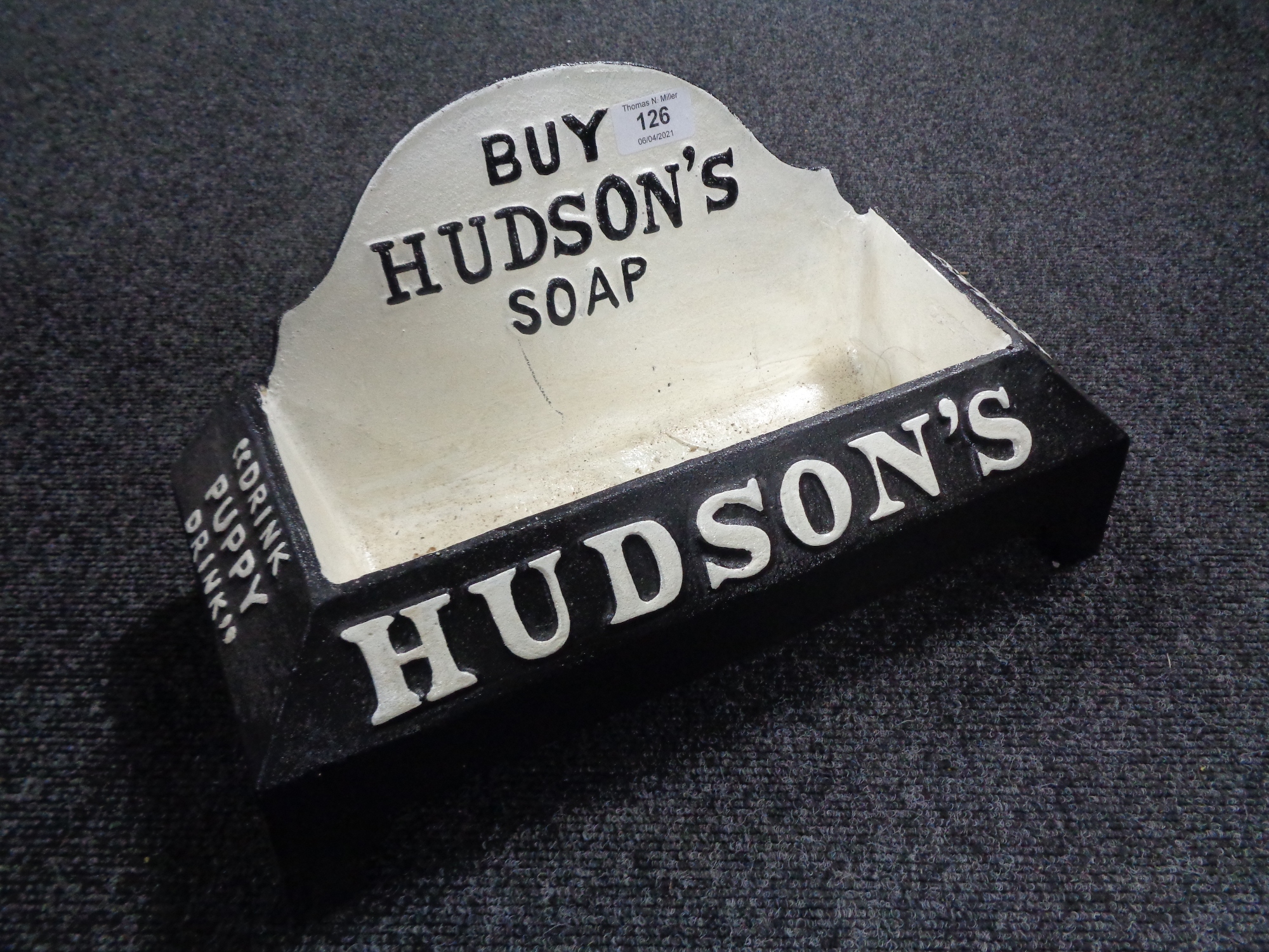 A cast iron "Hudson Soap" bowl