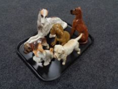 A tray of seven assorted figures of dogs including Goebel spaniel (damaged), Labrador,