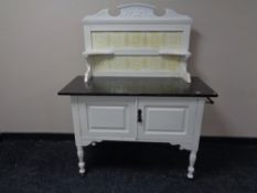 A late Victorian painted marble topped wash stand with tiled back