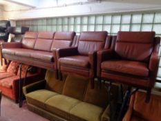 A three piece 20th century Danish lounge suite upholstered in a red leather