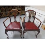 A pair of antique mahogany carver armchairs