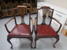 A pair of antique mahogany carver armchairs