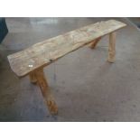 A rustic pine bench