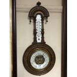 An Edwardian barometer with circular enamelled dial